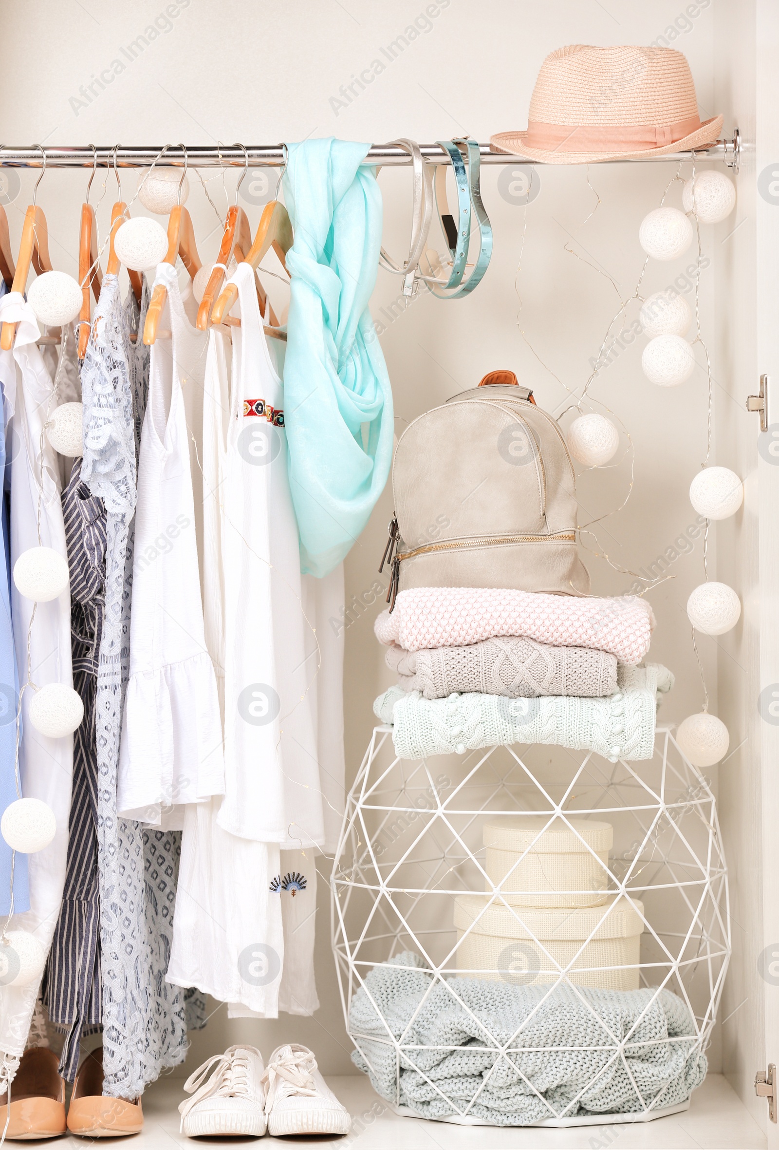 Photo of Women clothing on hangers in wardrobe