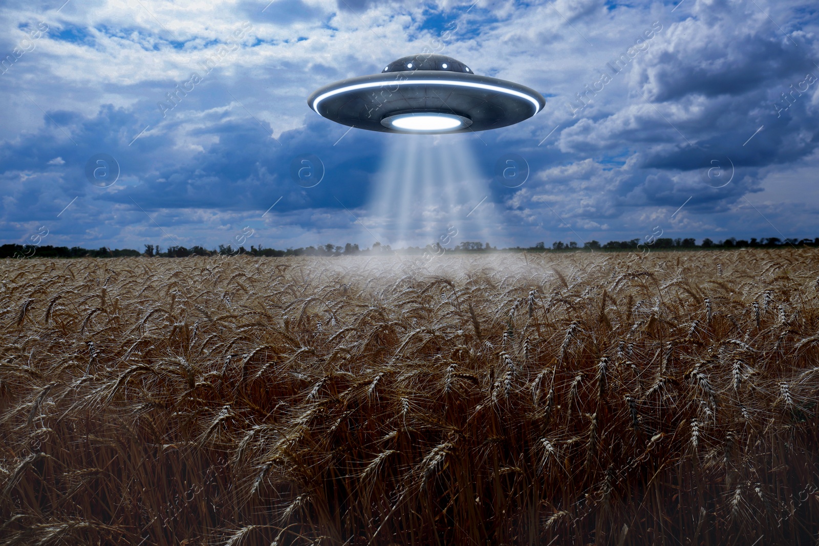 Image of Alien spaceship emitting light in air over wheat field. UFO