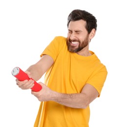 Emotional man with party popper on white background