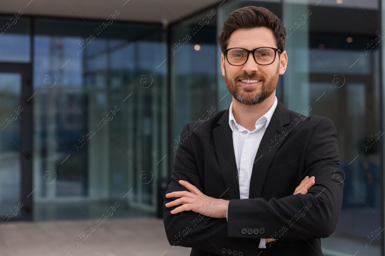 Photo of Happy real estate agent outdoors. Space for text