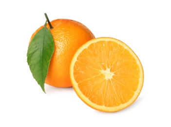 Cut and whole fresh ripe oranges with green leaf on white background