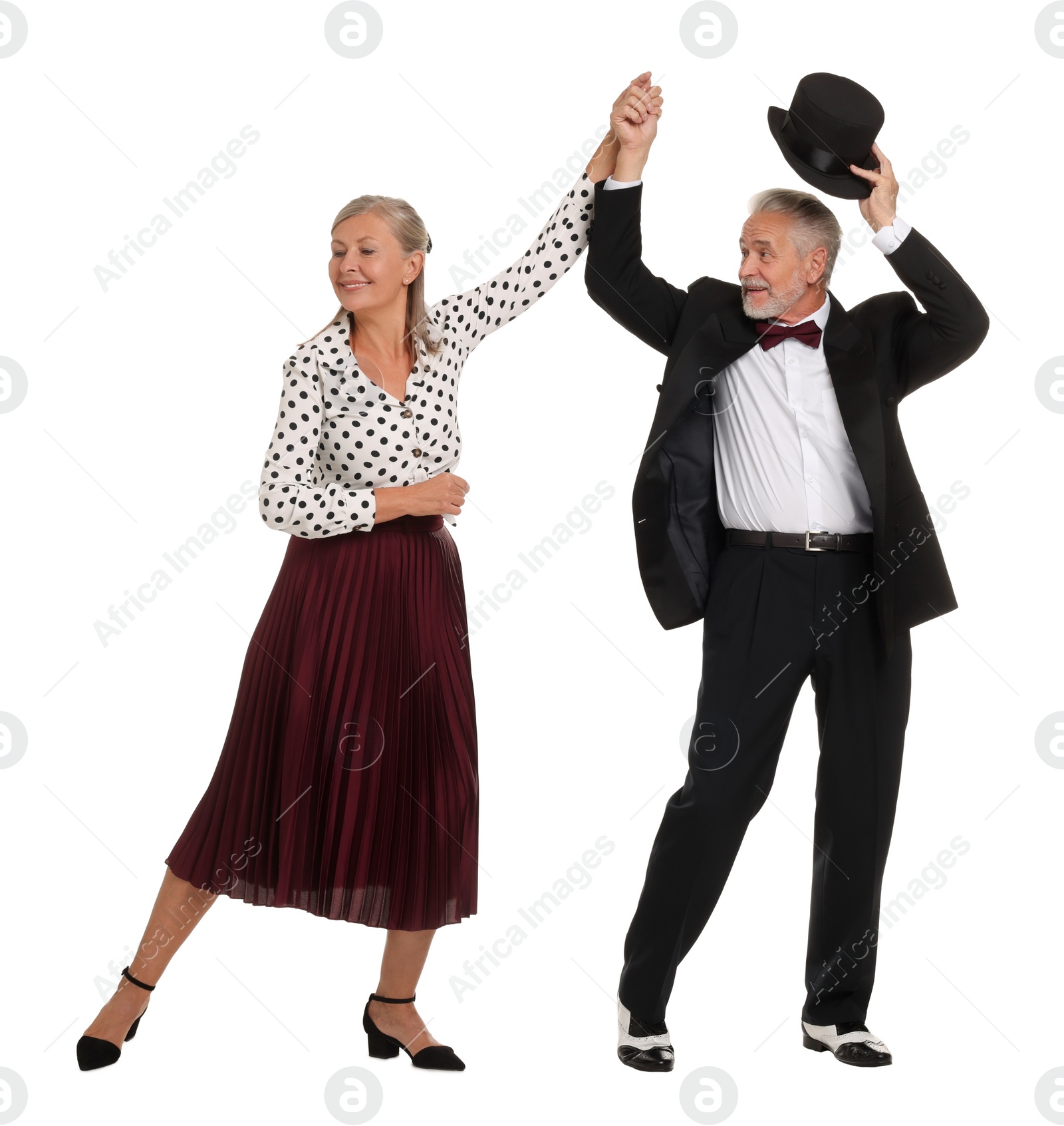 Photo of Senior couple dancing together on white background