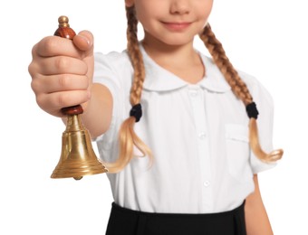Photo of Closeup view of pupil with school bell on white background