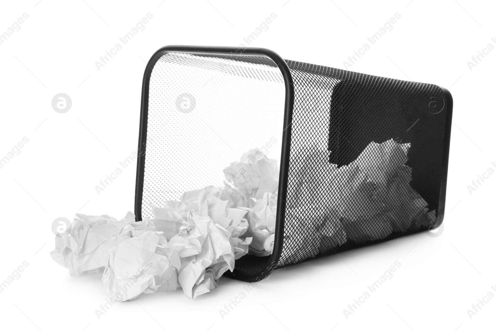 Photo of Basket with scattered crumpled paper balls on white background