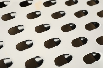 Modern metal grater as background, closeup view