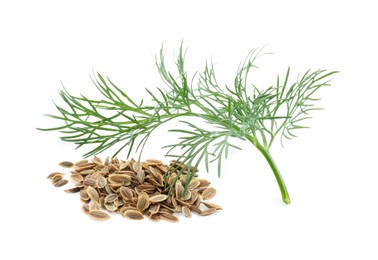Pile of dry seeds and fresh dill isolated on white