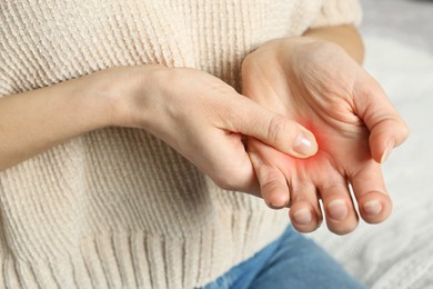 Image of Woman suffering from trigger finger, closeup view