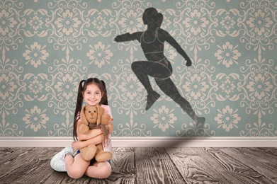 Image of Little girl with soft toy dreaming to be runner. Silhouette of woman behind kid's back