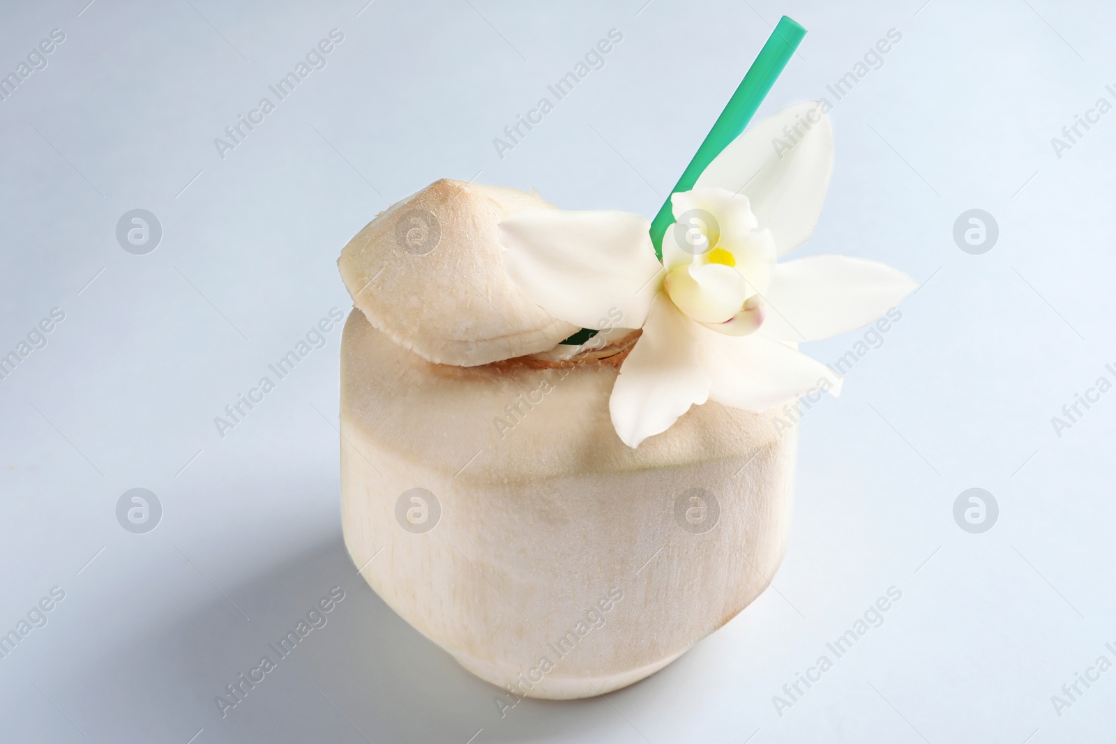 Photo of Fresh coconut drink in nut on white background