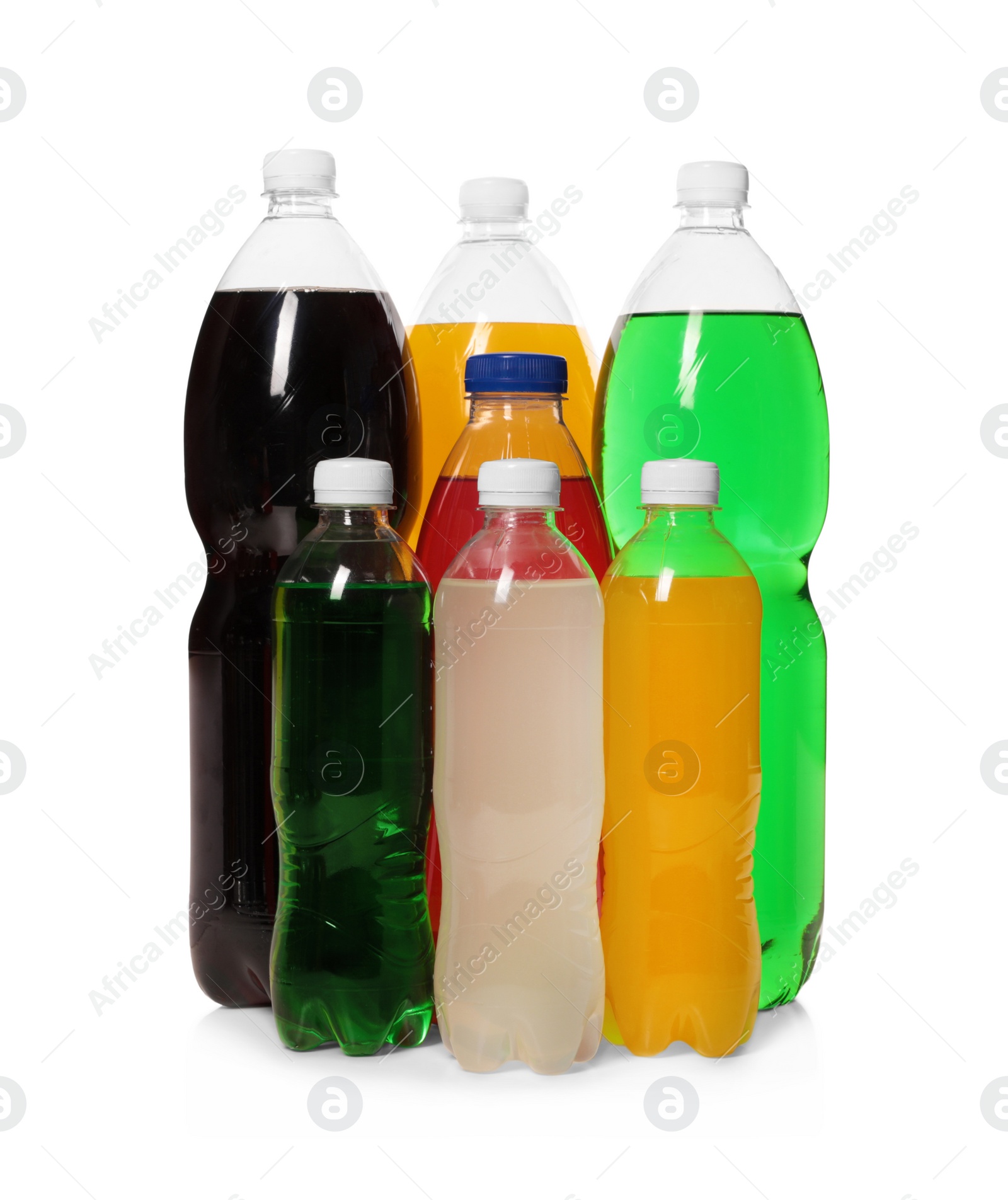 Photo of Bottles of soft drinks on white background