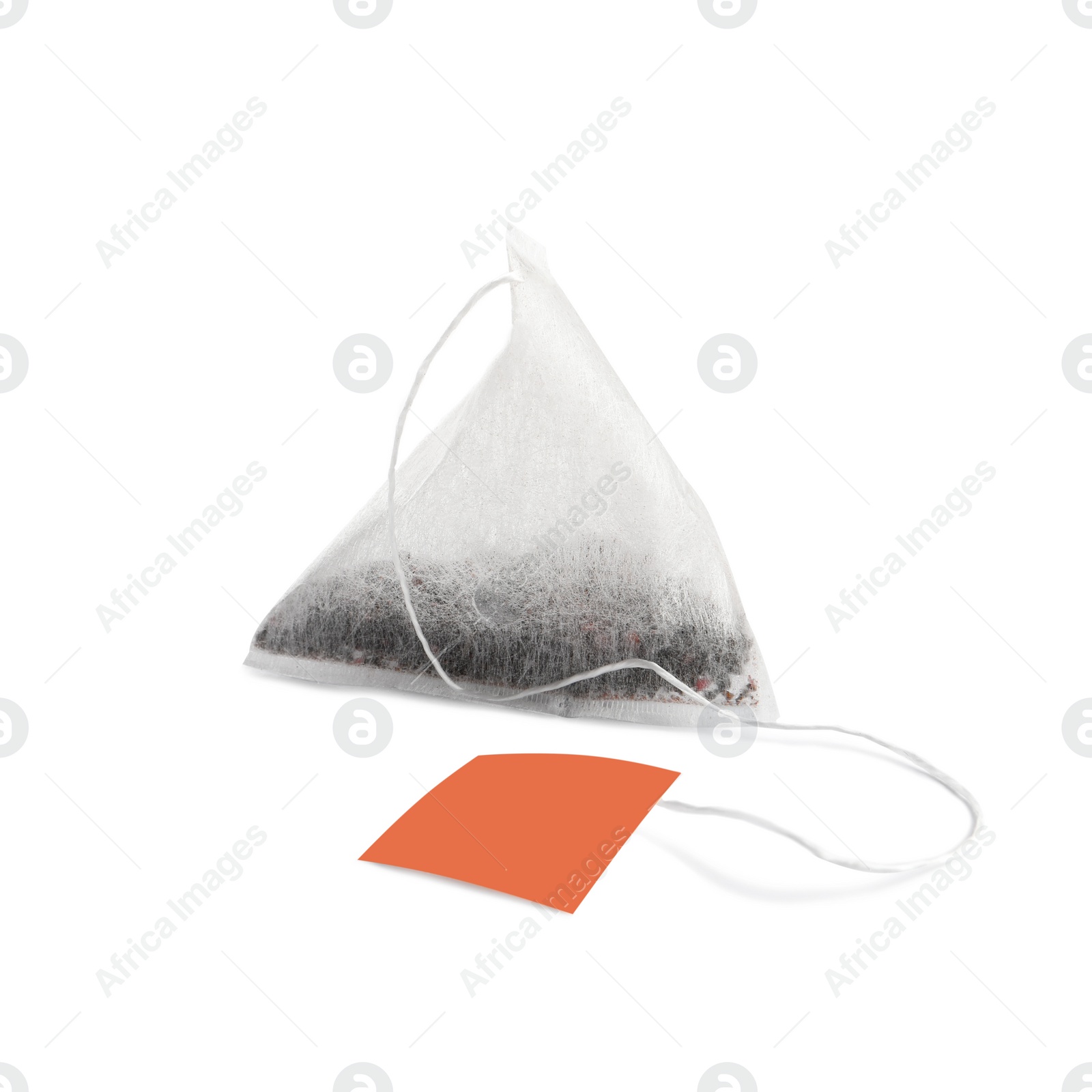 Photo of New pyramid tea bag isolated on white