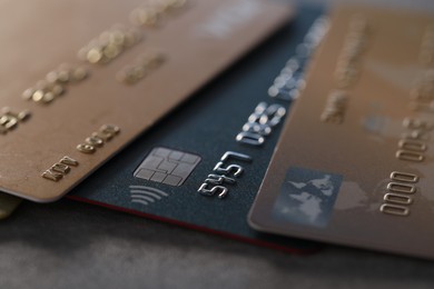 Photo of Plastic credit cards on table, macro view