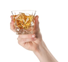 Man holding glass of whiskey with ice cubes on white background, closeup