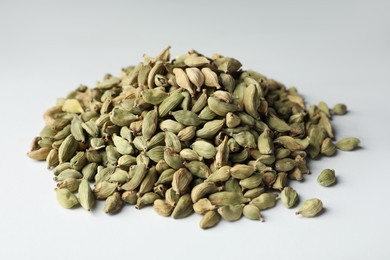 Photo of Pile of dry cardamom pods on light table