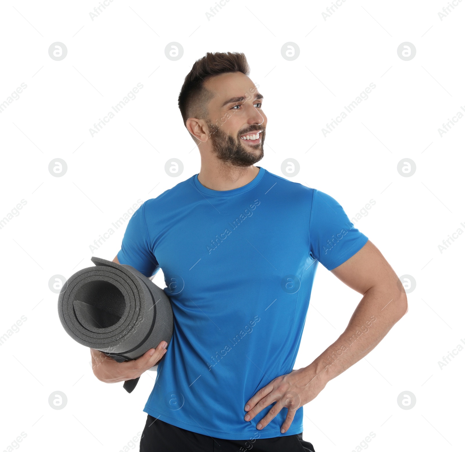 Photo of Handsome man with yoga mat on white background