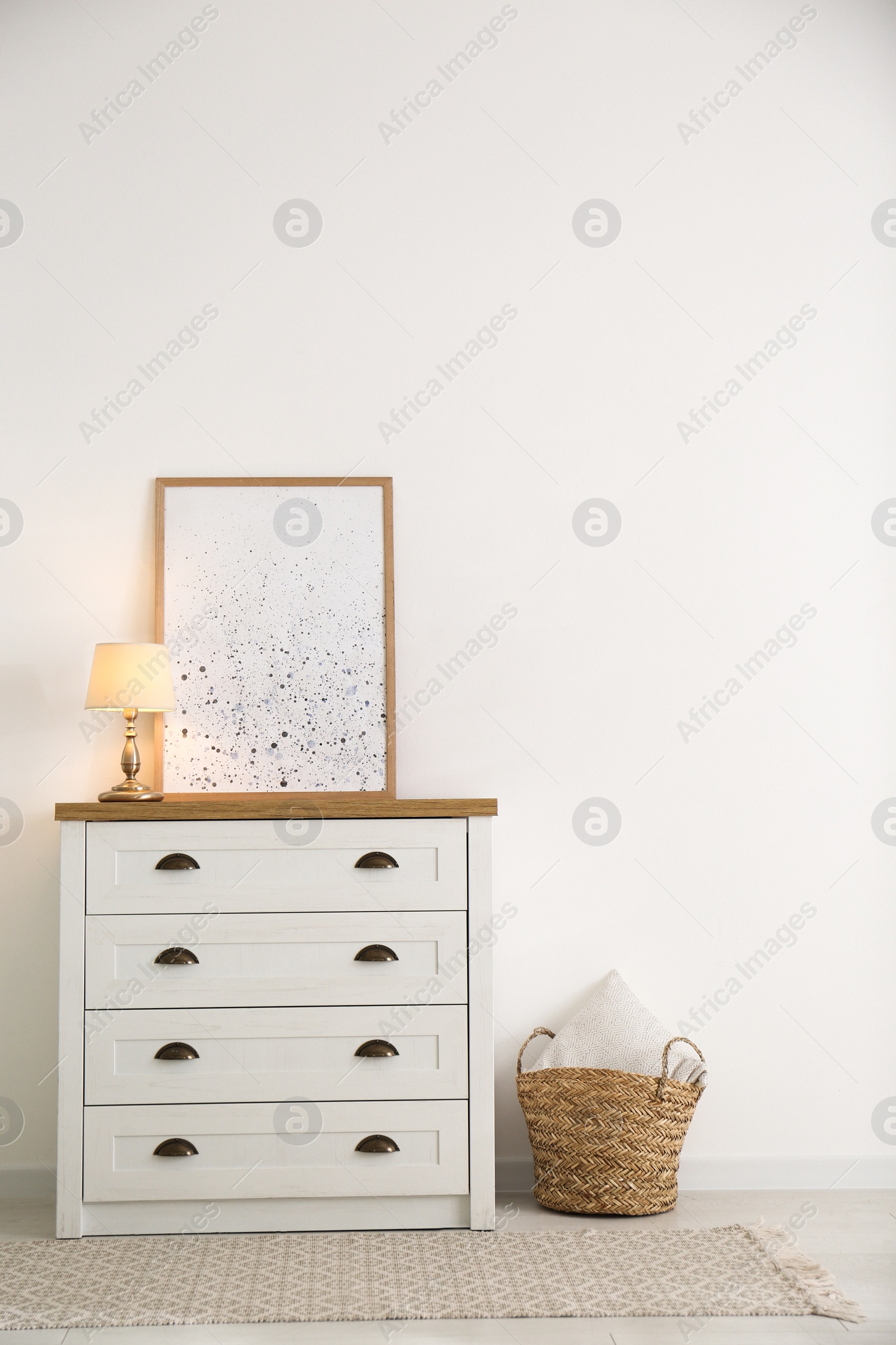 Photo of Stylish chest of drawers in living room interior