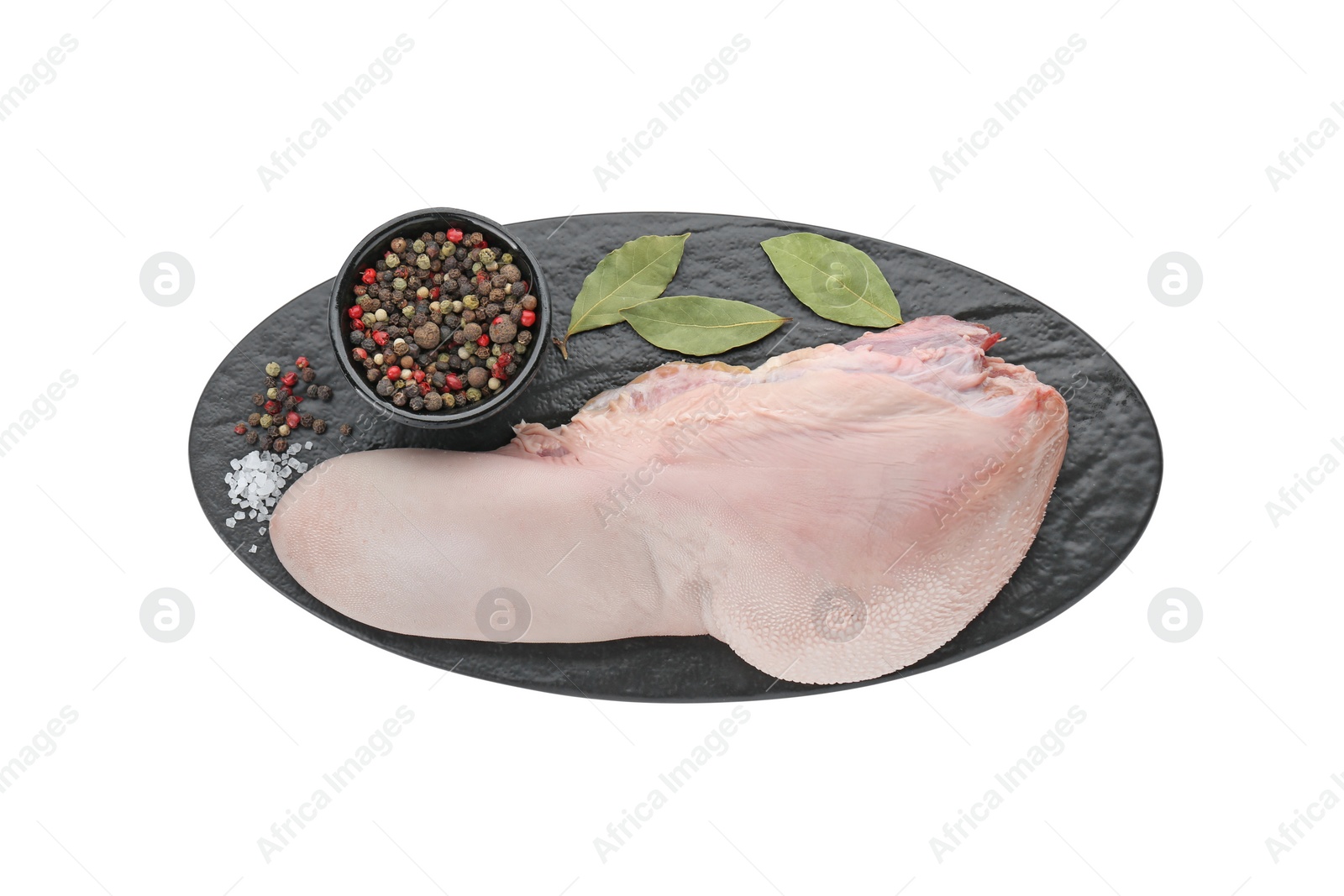 Photo of Serving board with raw beef tongue, peppercorns and bay leaves on white background, top view