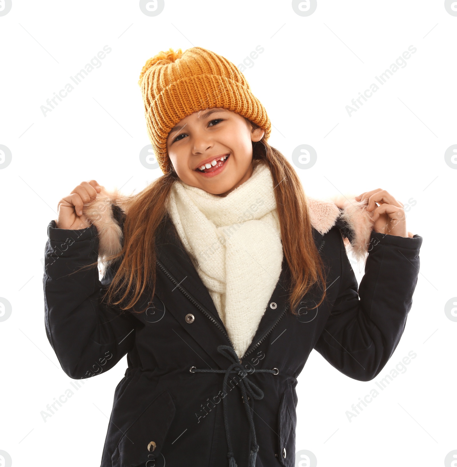 Photo of Cute little girl in warm clothes on white background. Winter vacation