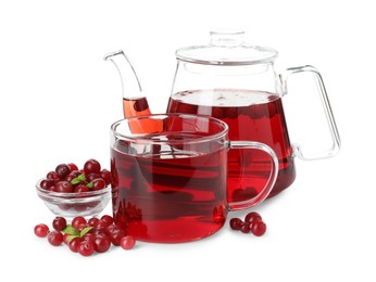 Photo of Delicious cranberry tea and berries isolated on white