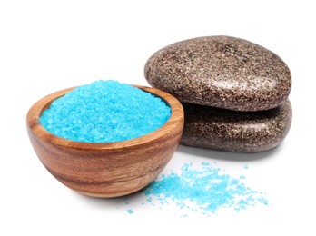 Photo of Light blue sea salt in bowl and spa stones isolated on white