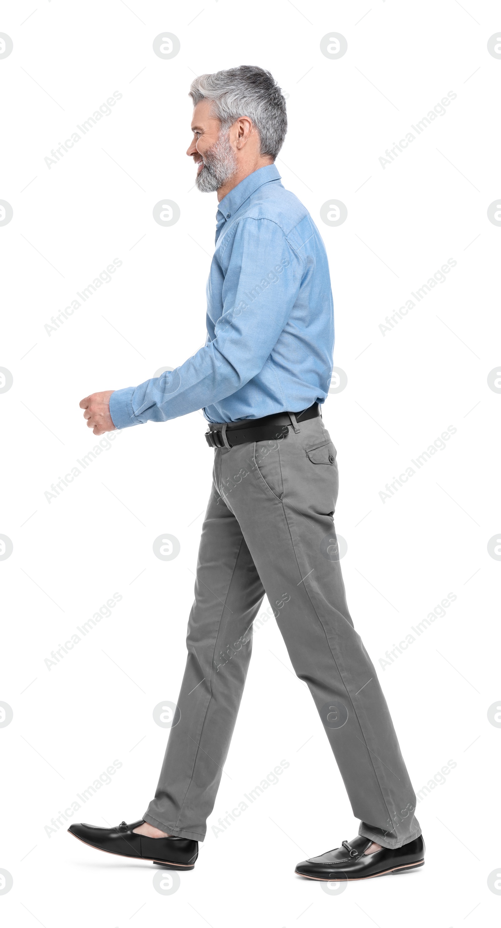 Photo of Mature businessman in stylish clothes posing on white background