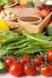 Many different healthy food on white table, closeup