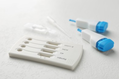 Photo of Disposable multi-infection express test kit on white table, closeup