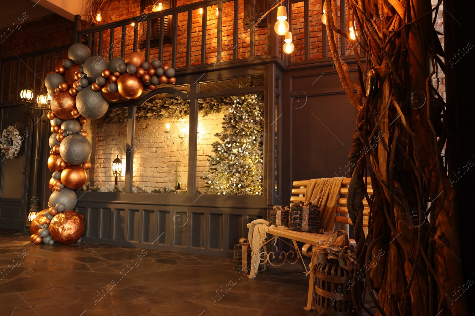 Photo of Room interior with Christmas tree, bench and festive decor