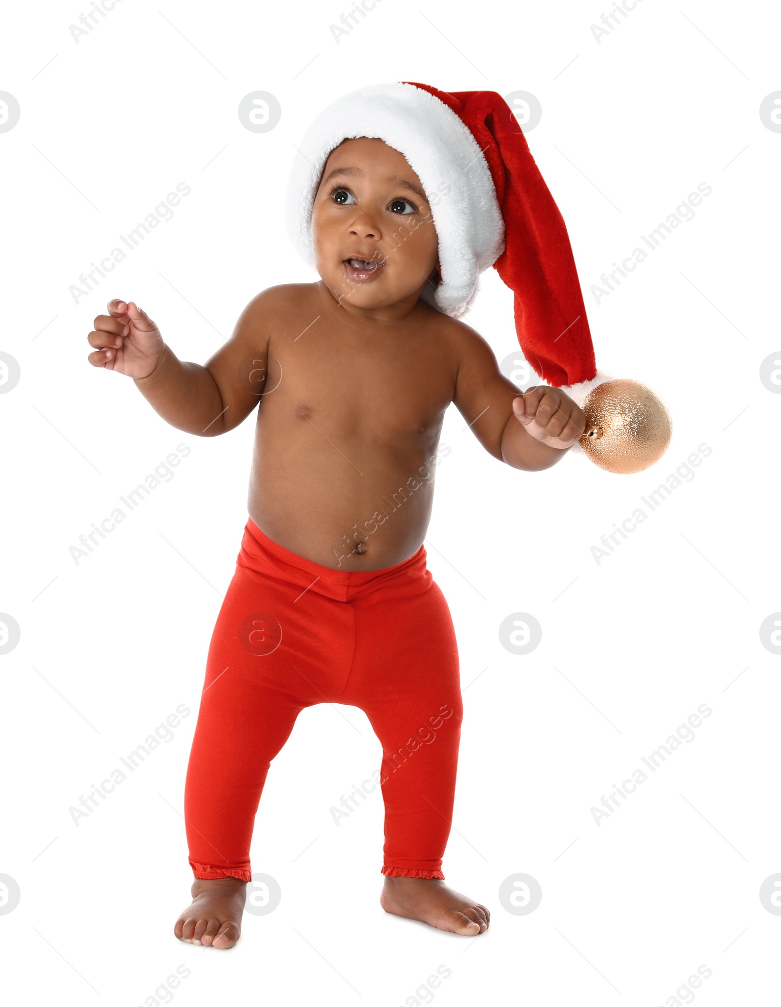 Photo of Cute African-American baby wearing Santa hat on white background. Christmas celebration