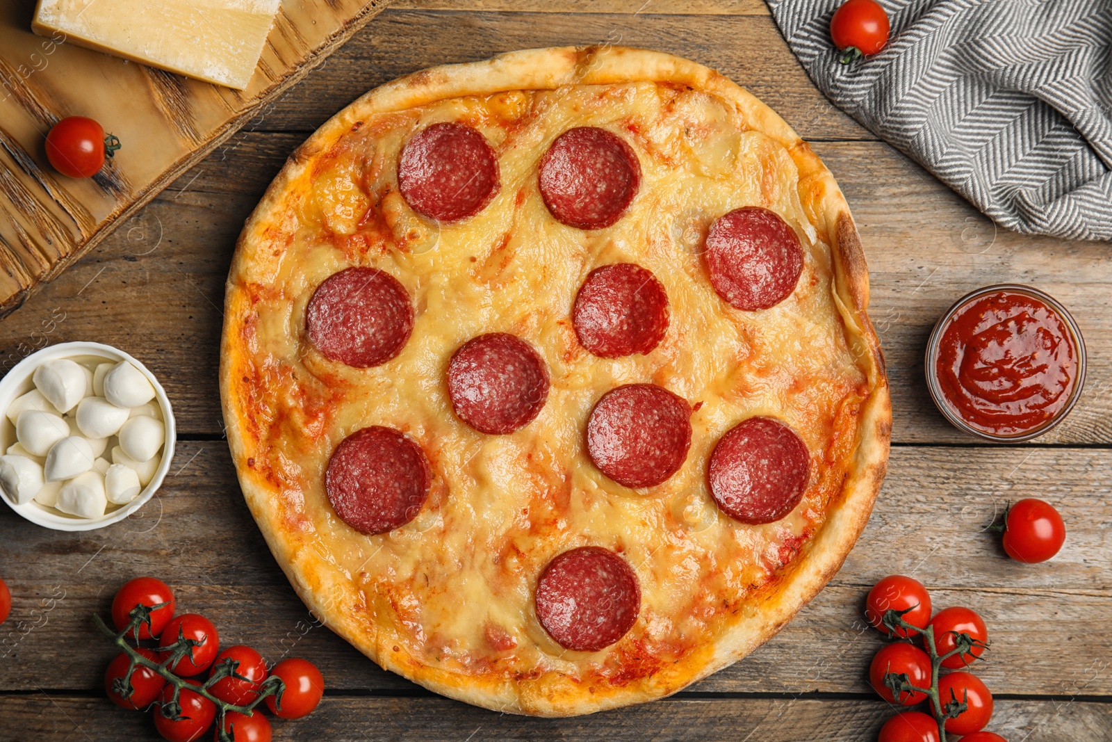 Photo of Flat lay composition with tasty pepperoni pizza on wooden table