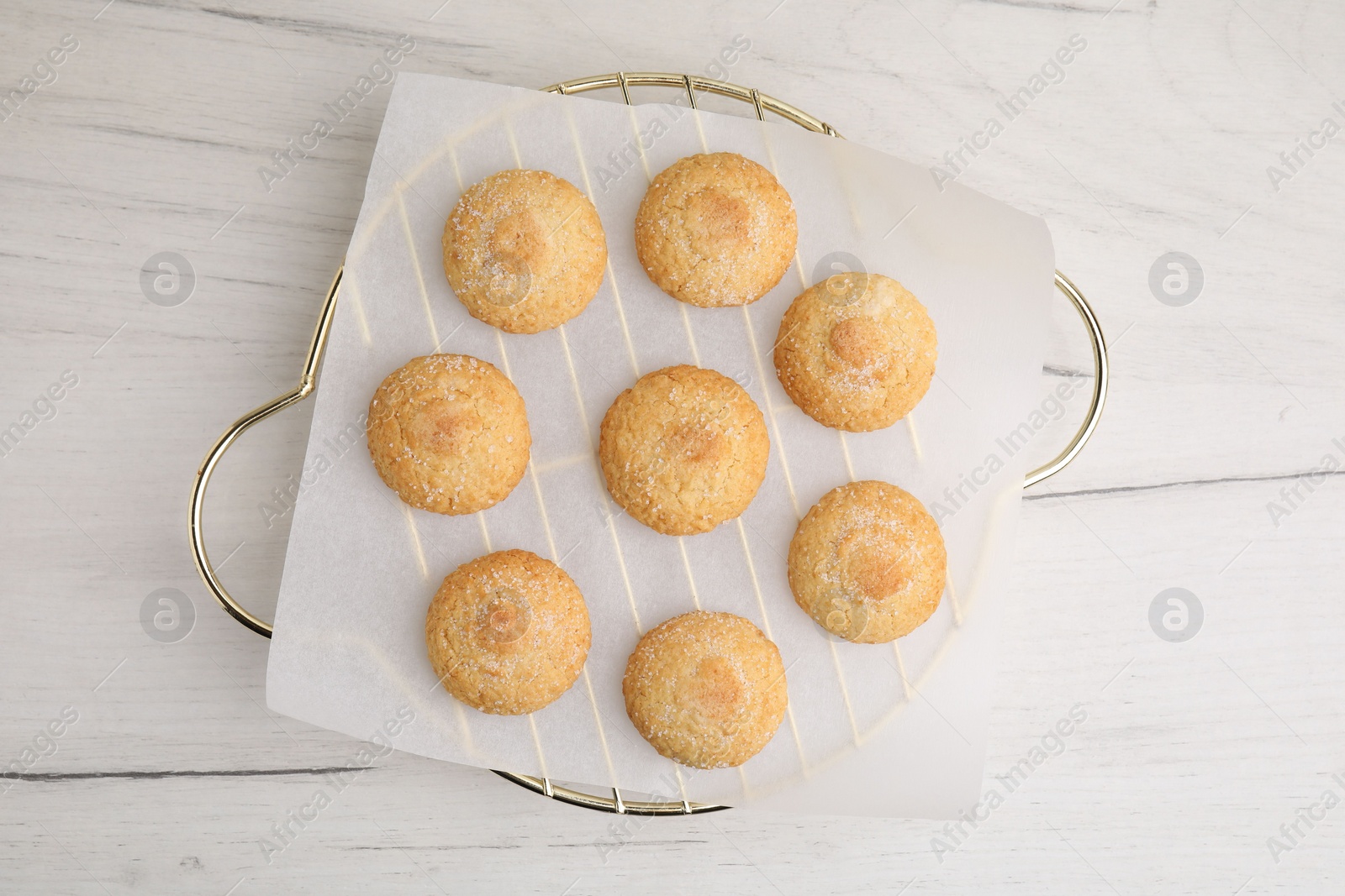 Photo of Tasty sweet sugar cookies on white wooden table, top view