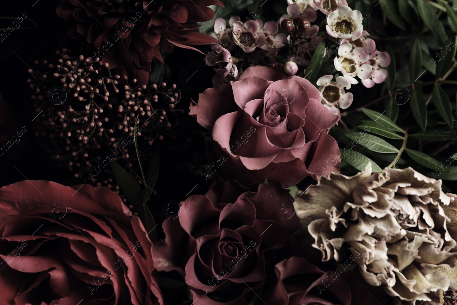 Photo of Beautiful bouquet of different flowers, closeup. Floral card design with dark vintage effect