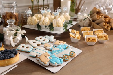 Photo of Tasty treats on table in room. Baby shower party
