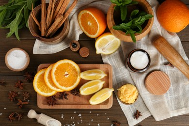 Photo of Flat lay composition with homemade cosmetic products and fresh ingredients on wooden table