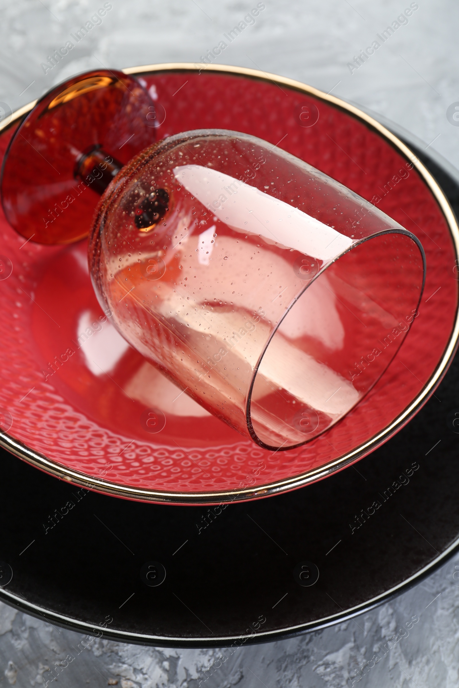 Photo of Clean plates, bowl and glass on table, closeup