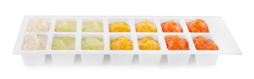 Photo of Different purees in ice cube tray on white background. Ready for freezing
