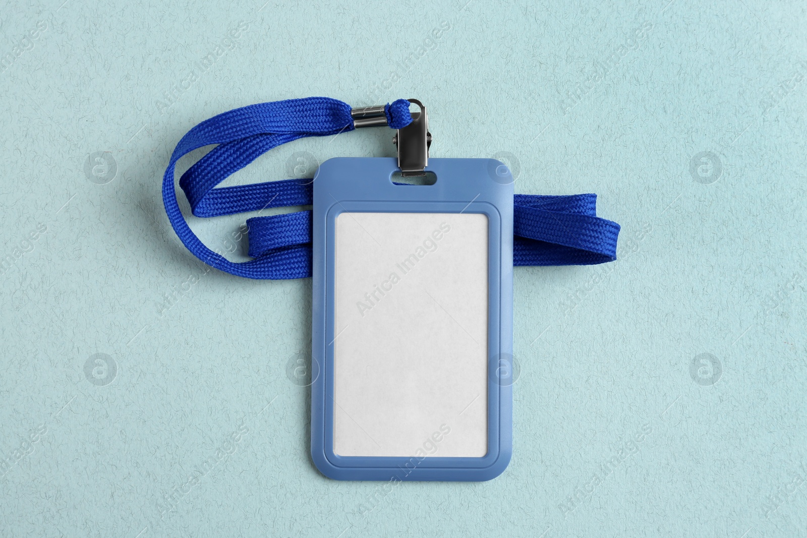 Photo of Blank badge on light table, top view. Mockup for design