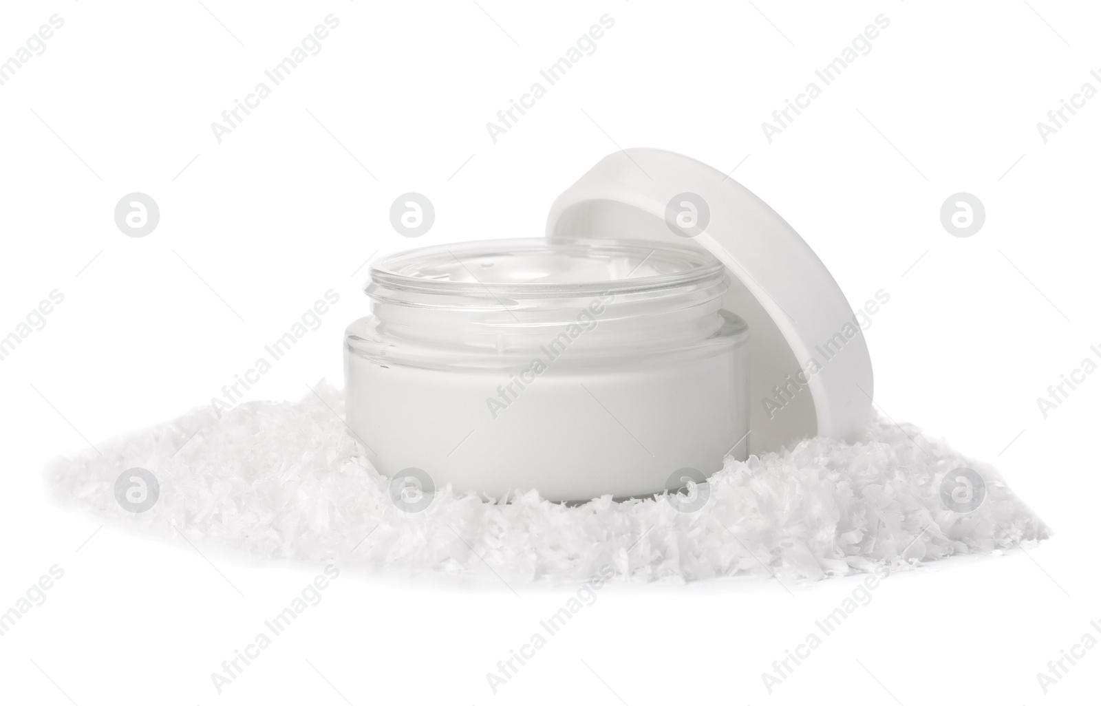 Photo of Jar of hand cream and decorative snow isolated on white. Winter skin care