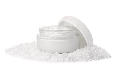 Photo of Jar of hand cream and decorative snow isolated on white. Winter skin care