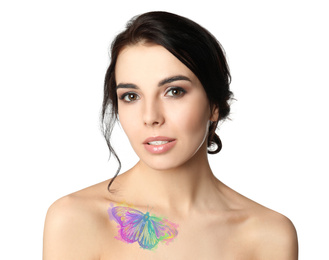Young woman with colorful tattoo of butterfly on her body against white background