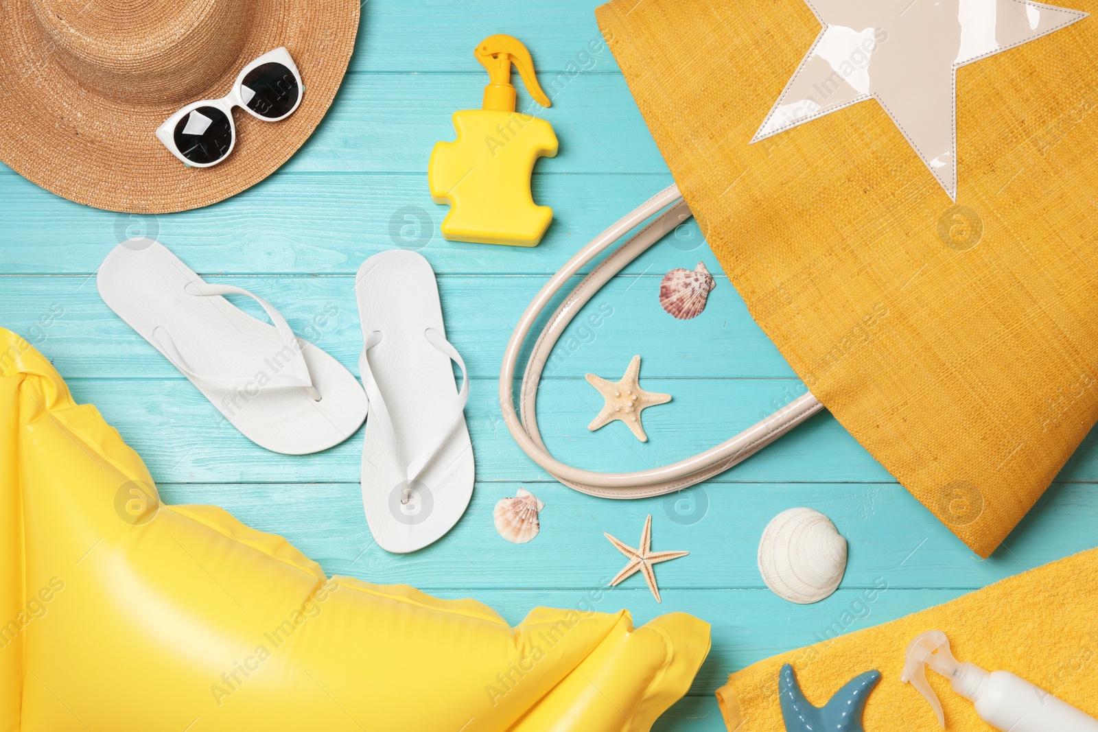 Photo of Flat lay composition with beach accessories on wooden background