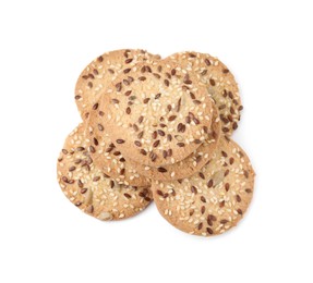 Photo of Round cereal crackers with flax, sunflower and sesame seeds isolated on white, above view