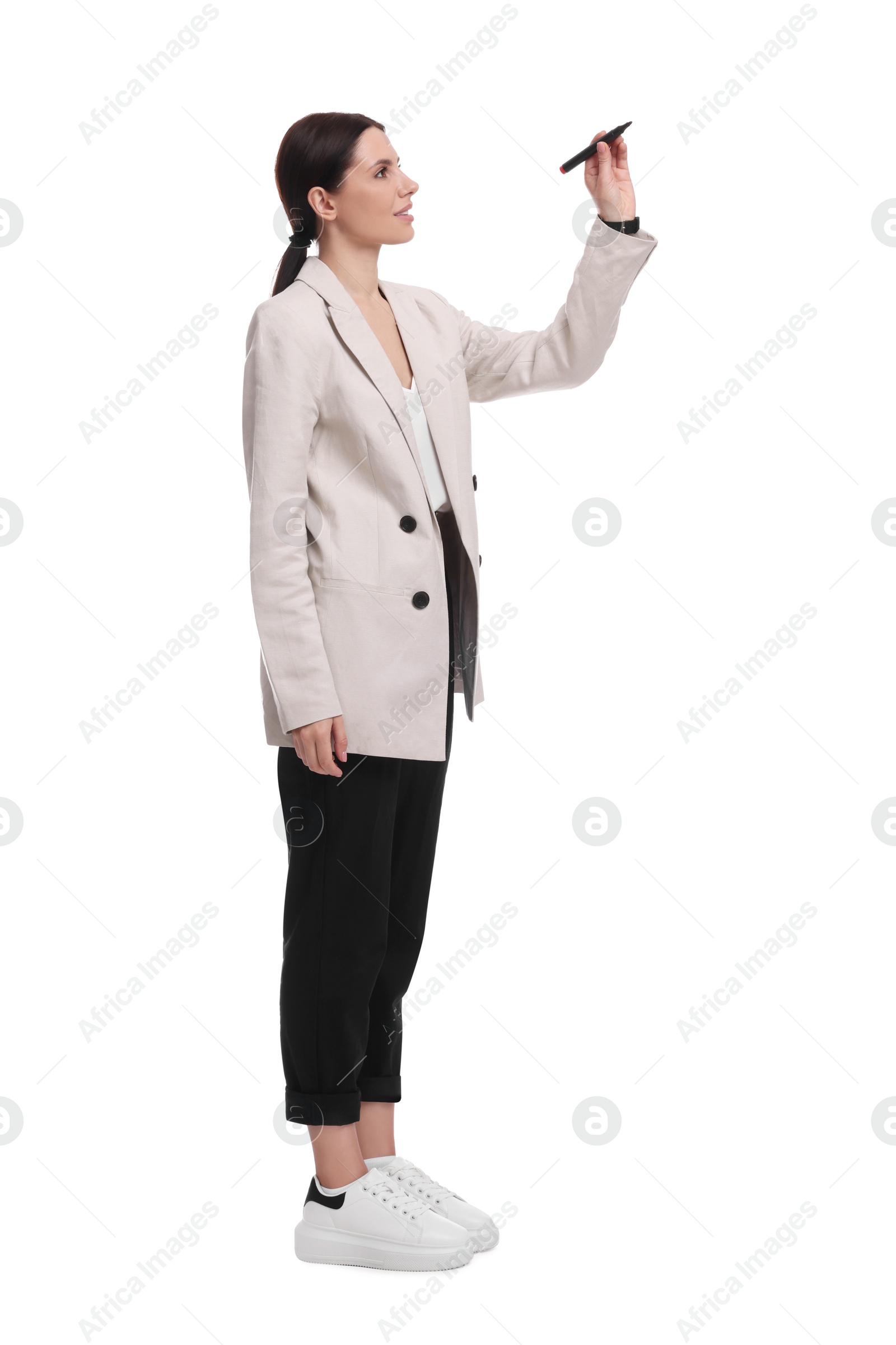 Photo of Beautiful businesswoman in suit with marker on white background