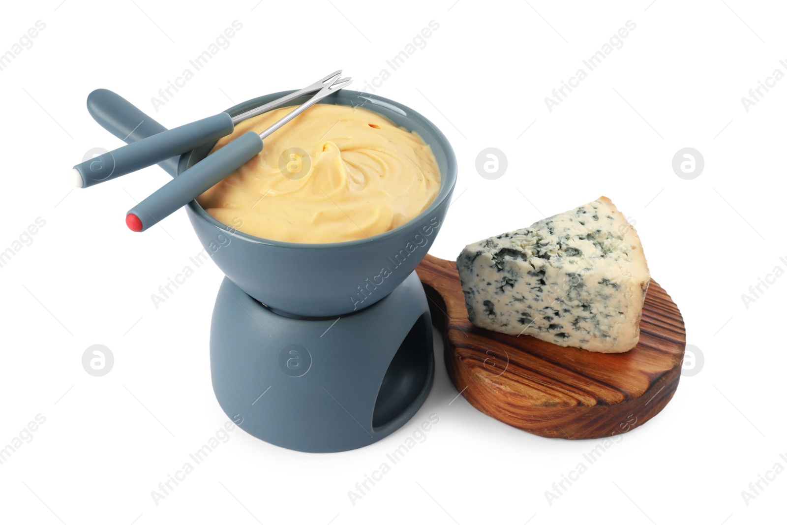 Photo of Fondue with tasty melted cheese, forks and piece isolated on white