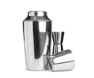 Photo of Metal cocktail shaker, jigger and cup on white background