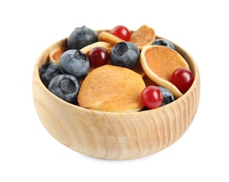 Photo of Delicious mini pancakes cereal with berries on white background