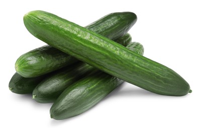 Photo of Many long fresh cucumbers isolated on white