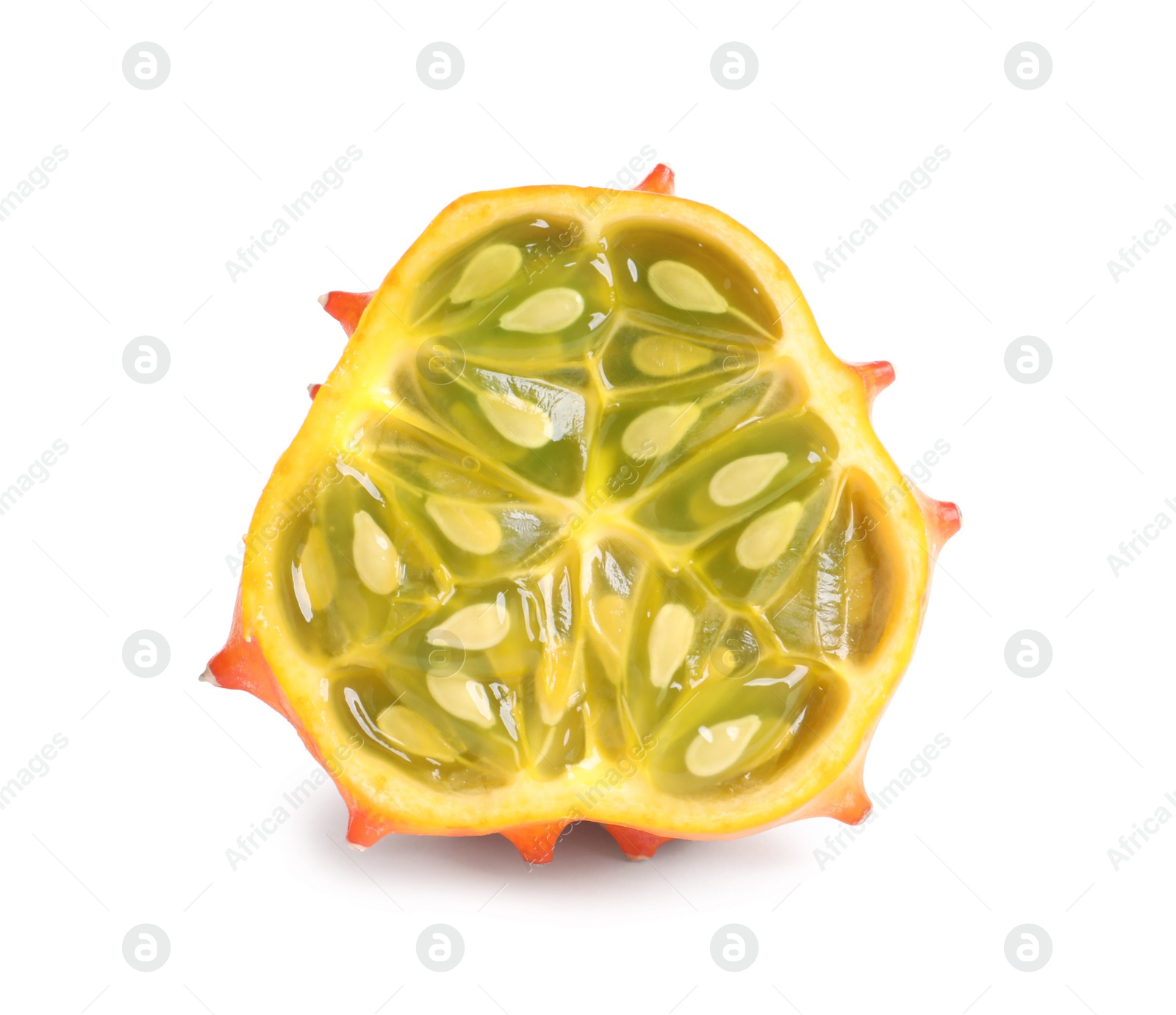 Photo of Half of ripe kiwano isolated on white. Exotic fruit