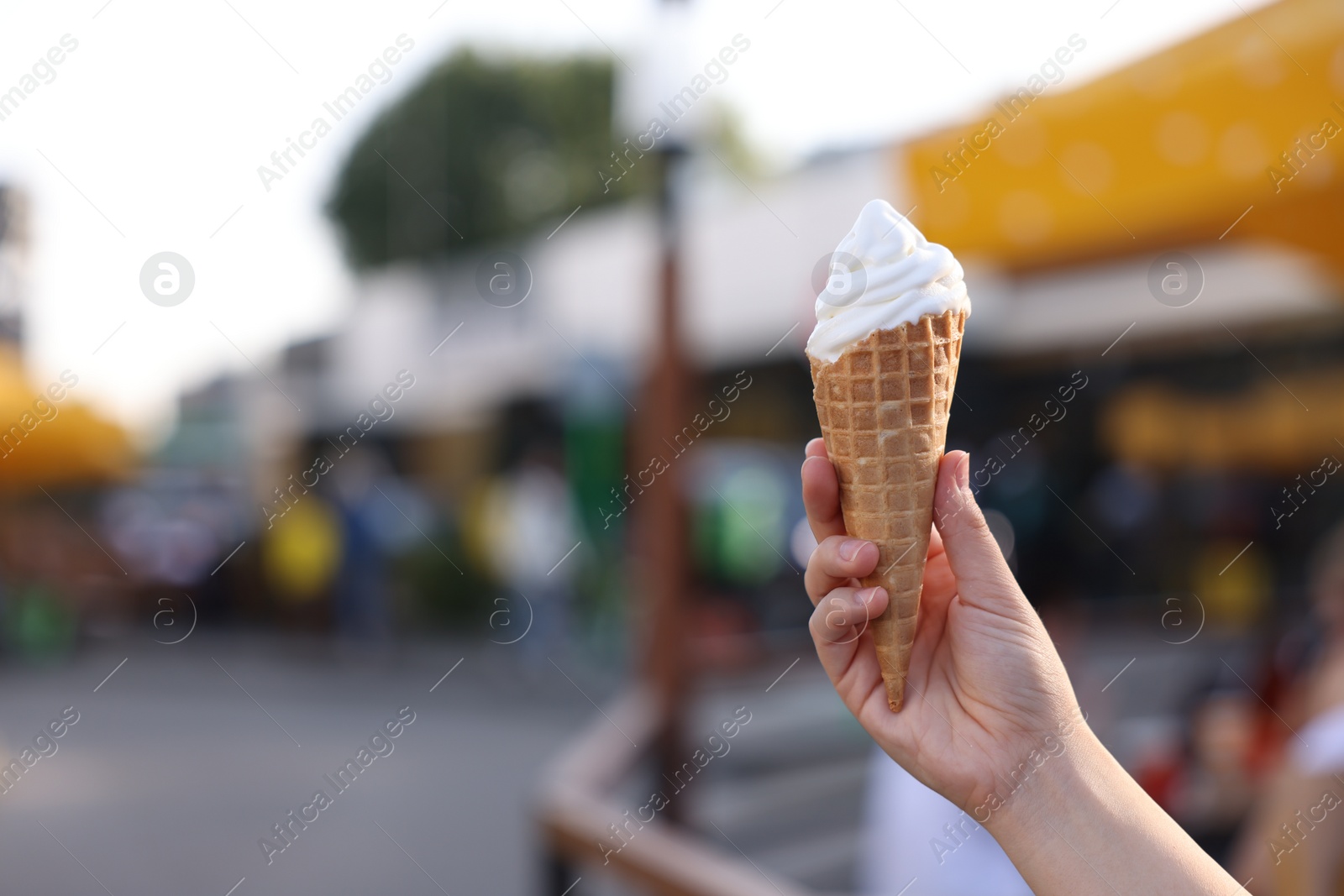 Photo of Lviv, Ukraine - September 26, 2023: Woman with McDonald's ice cream outdoors, closeup. Space for text