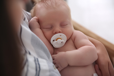 Photo of Mother with her newborn baby, closeup view